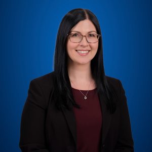 Brittany Potter headshot with blue background